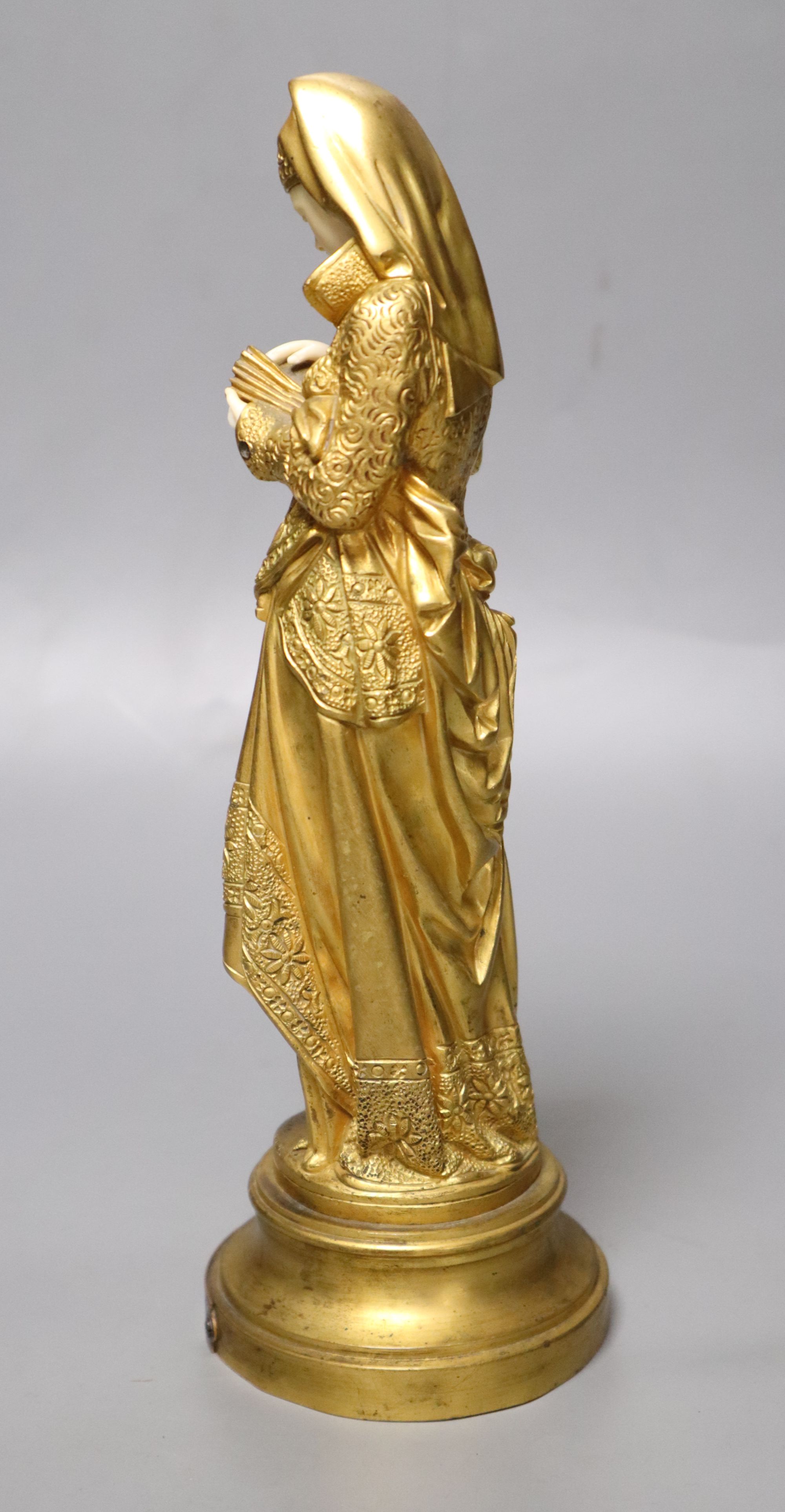 After Carrier-Belleuse. A gilt bronze and ivory figure, height 25cm